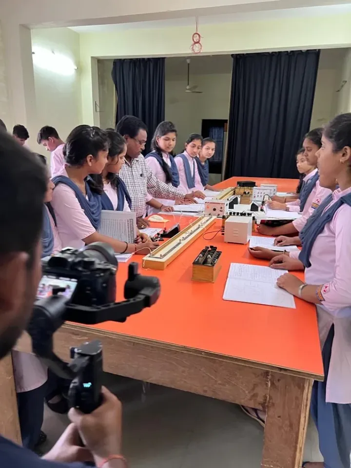 Filming students in a school physics lab
