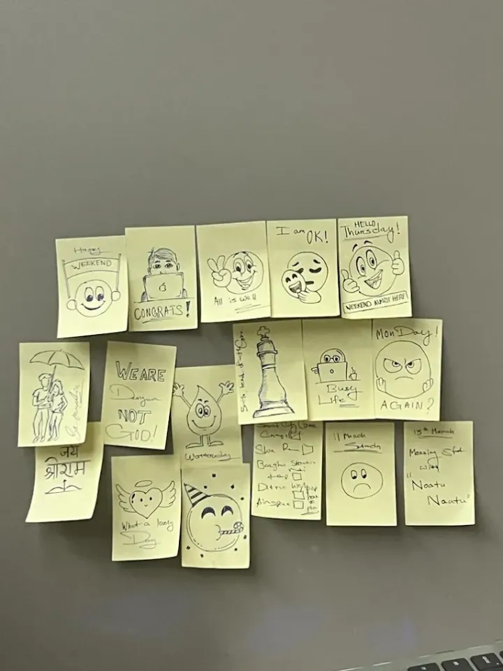 Sticky-note doodles on the studio wall